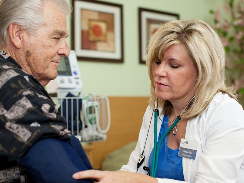A caregiver/nurse and a resident at Bishop Care