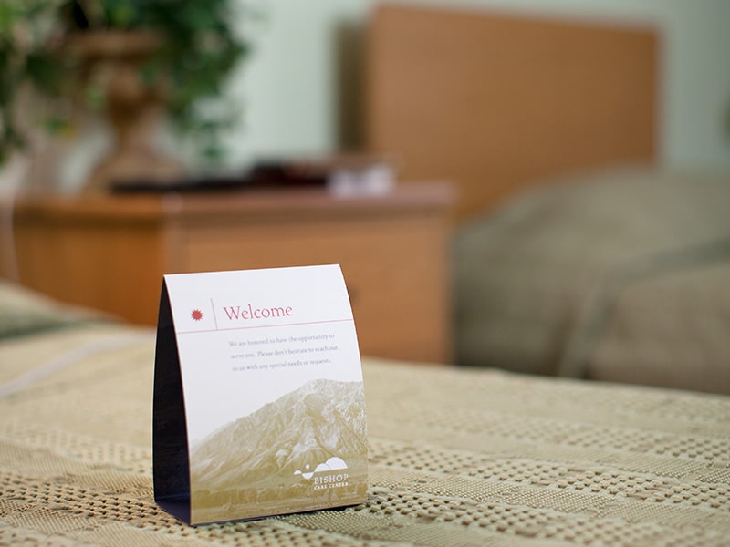 A welcome card tent in a Semi-private room at Bishop Care