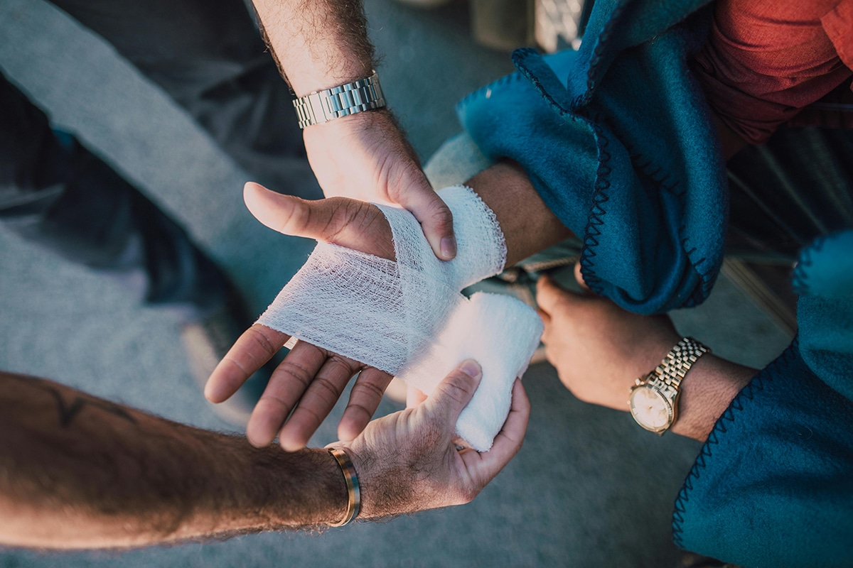 Patient having hand bandaged